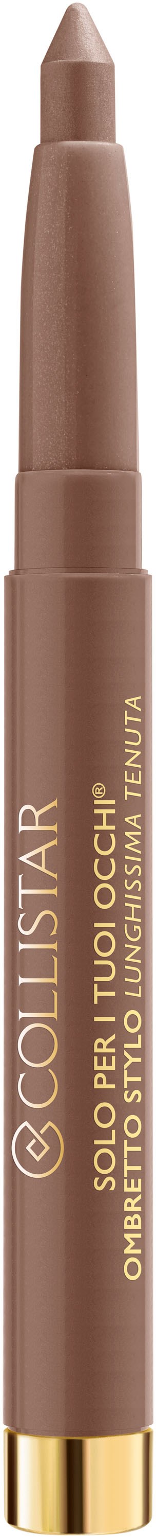 Ein brauner Make-up-Stift mit goldenen Akzenten und goldener Schrift, steht auf schwarzem Hintergrund.