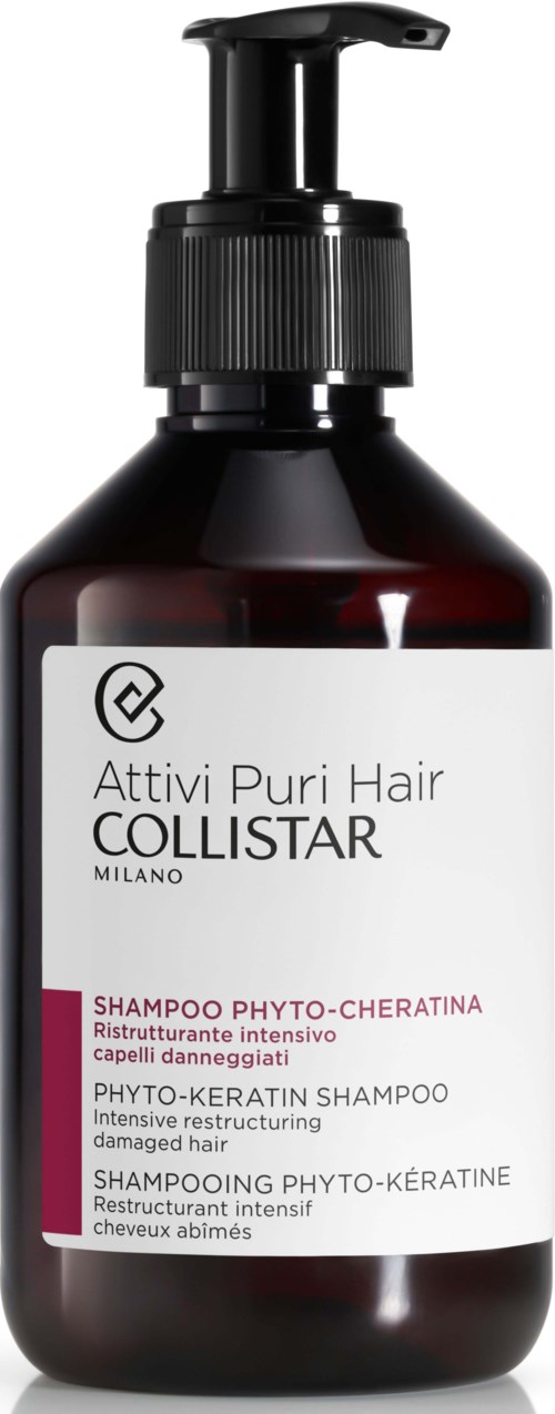 Donkere bruine fles met zwarte pomp bevat shampoo voor beschadigd haar, met witte en roze labeltekst.