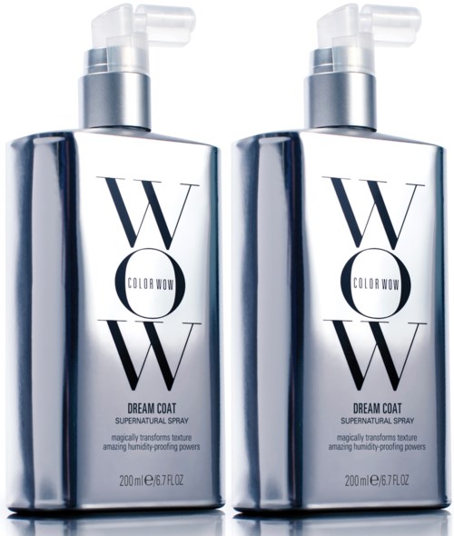Two silver spray bottles labeled "Dream Coat" stand side by side, reflecting light and appearing shiny. They are used for hair treatment.
