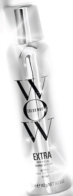 Een wit sprayflesje met label 'W W W EXTRA' en een metalen dop en zwarte tekst.