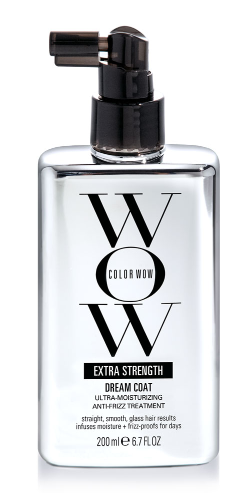 A clear bottle with black spray nozzle, labeled 'Wonder Color Wow Dream Coat Extra Strength,' for hair treatment.