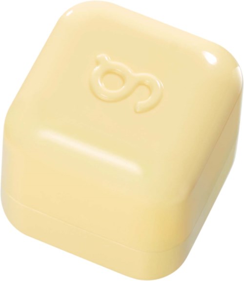En gul såpe med en 'O'-formet design på toppen.