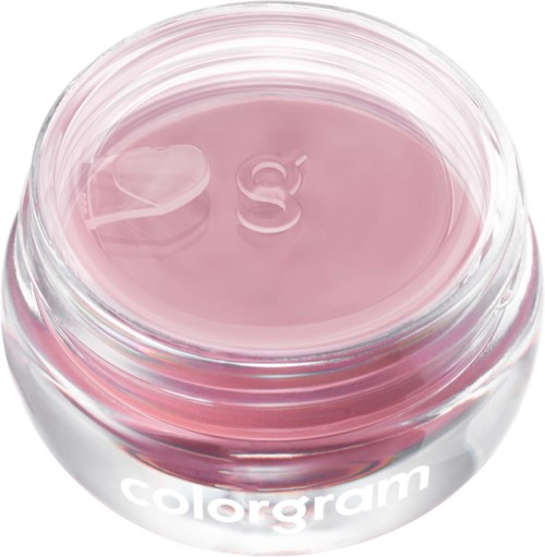 En liten rund glassbeholder med rosa gelé eller krem inni, merket colorgam.