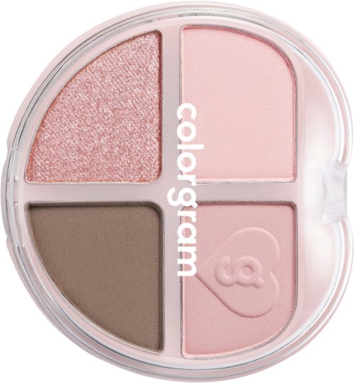 En rund makeup-pallett med fire seksjoner av rosa, brunt og glitter øyenskygger og en rosa ansiktsformet highlighter.