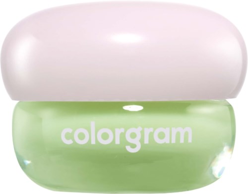 En liten grønn beholder med ordet "colorgam" og en rosa lokk oppå.