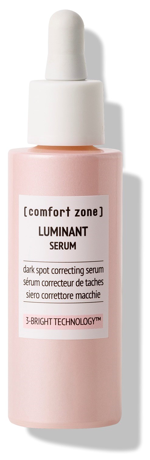 A pink dropper bottle labeled "LUMINANT SERUM" for dark spot correction. It has a white cap and comes from Comfort Zone.
