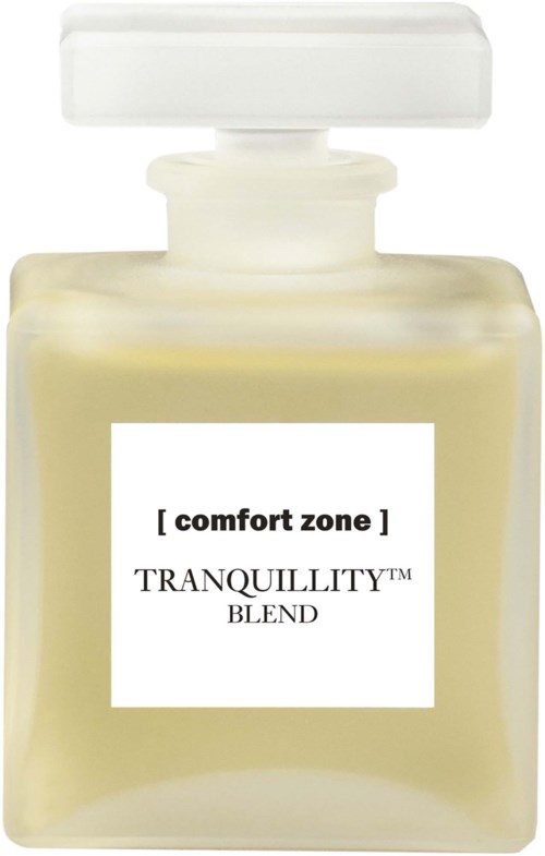 Herkuttelupullo, jossa lukee comfort zone TRanquillity blend, valkoinen kansi ja läpinäkyvä lasi, jossa on keltainen neste.