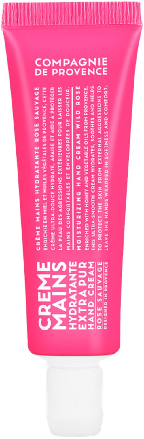 Pink tube of hand cream from Compagnie de Provence with white text, featuring product details and branding.