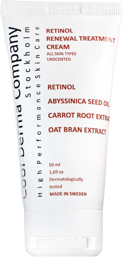 A white tube of skincare cream with black and red text, highlighting ingredients like Retinol and Carrot Root Extract.