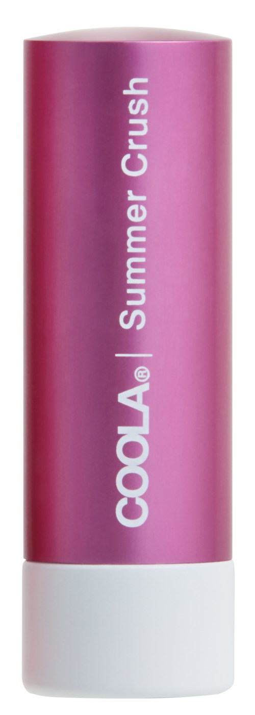 En rosa og hvit sylinderformet tube med leppepomade med teksten "COOLA Summer Crush" på.