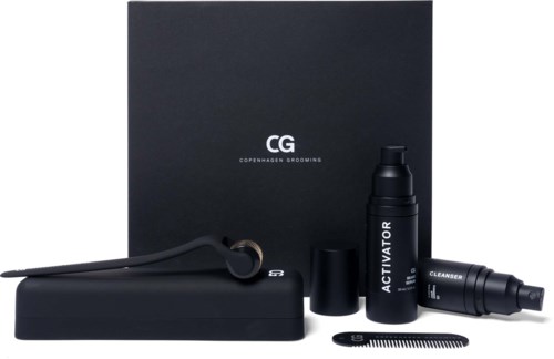 A grooming kit with a black box, spray, spray cap, brush, and a black device labeled "Activator."