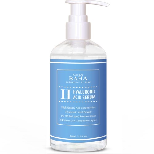 A clear bottle with a pump, labeled Hyaluronic Acid Serum, contains skincare product and has a blue label.