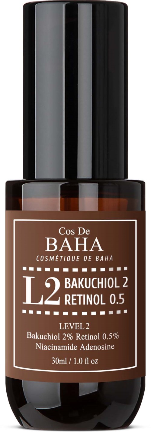 Een kleine bruine fles met een zwarte dop, label 'Cos De Baha L2 Bakuchiol 2 Retinol 0.5' voor huidverzorging.