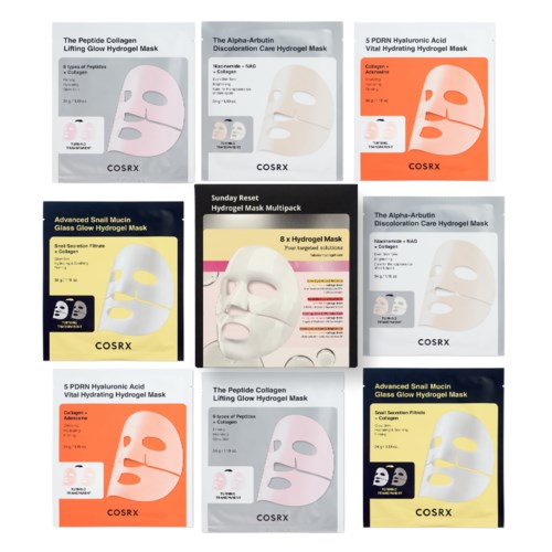 Various face mask packaging with different ingredients and colors, mostly white and orange, on a display.