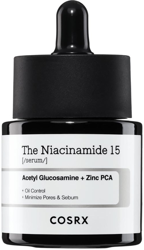 Een kleine zwarte fles met druppelaar, gelabeld 'The Niacinamide 15' serum, voor huidverzorging tegen olie.