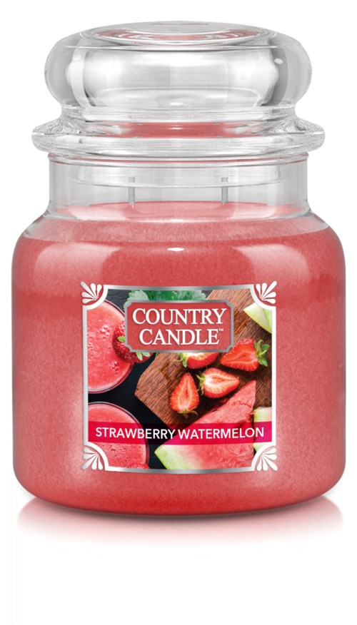 A pink candle inside a glass jar with a label showing strawberries and watermelon. The label reads "Country Candle" and "Strawberry Watermelon."