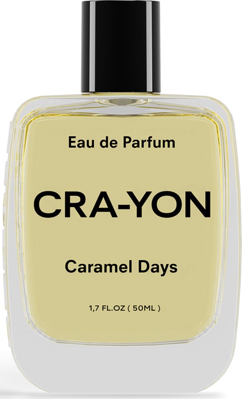 Een parfumfles met label 'Cra-Yon Caramel Days' en een zwarte dop, gevuld met lichtgele vloeistof.