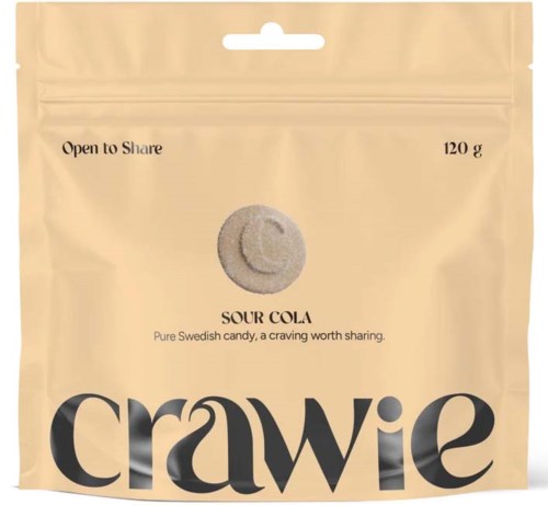 Beige godispåse med sour cola-glasyr, med en grå karamell och Crawie-logotyp i botten.