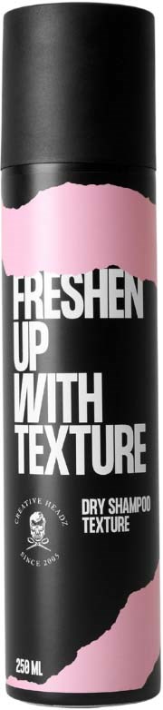 A black and pink aerosol can of dry shampoo with bold white text, claiming to refresh hair with texture.