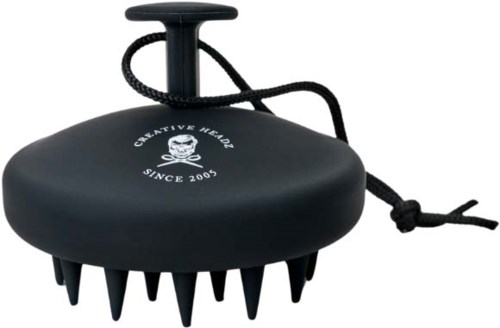A black board with rubber spikes and a tether, used for massage or relaxation.