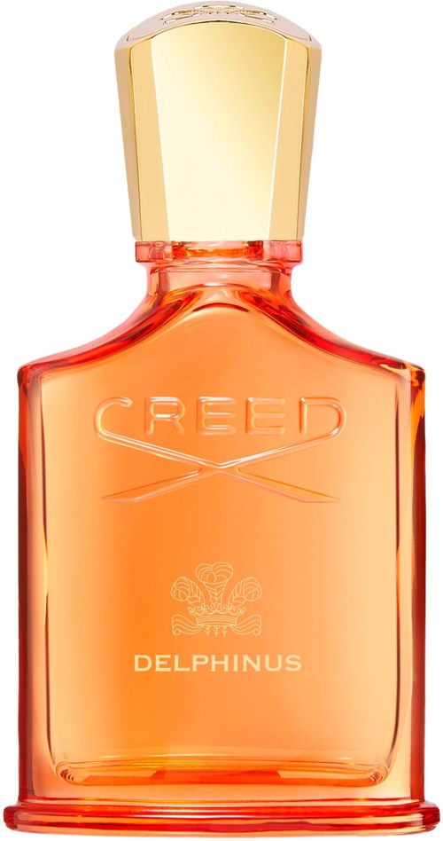 En liten, orange parfymflaska med guldkapsel och orden 'CREED DELPHINUS' på.