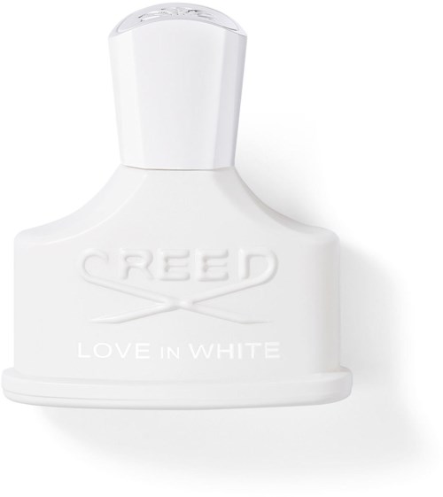 Hvitt parfymehode med merkevaren 'Creed' og 'Love in White' skrevet på.