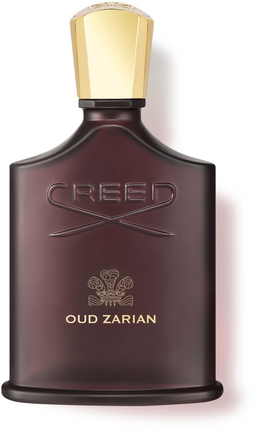 En mörk flaska med guldlock märkt 'Creed Oud Zarian' för parfym.