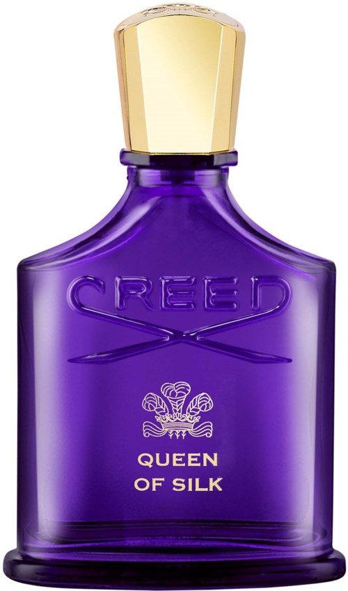 En lila parfymflaska med guldlock, märkt 'Creed Queen of Silk.'