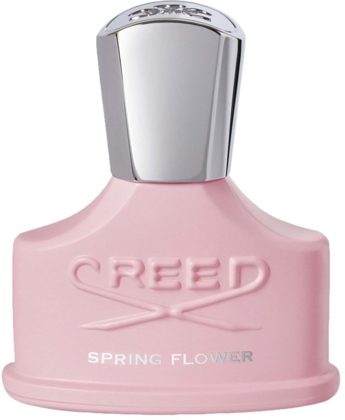 En rosa parfymflaska med en silverkapsyl och orden 'CREED SPRING FLOWER' på sig.