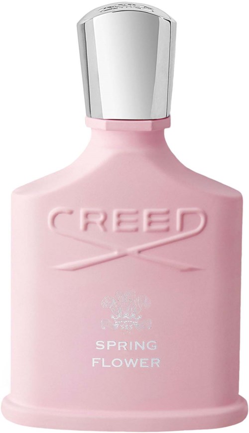 En rosa parfymflaska med silverlock och orden 'Creed Spring Flower' på.
