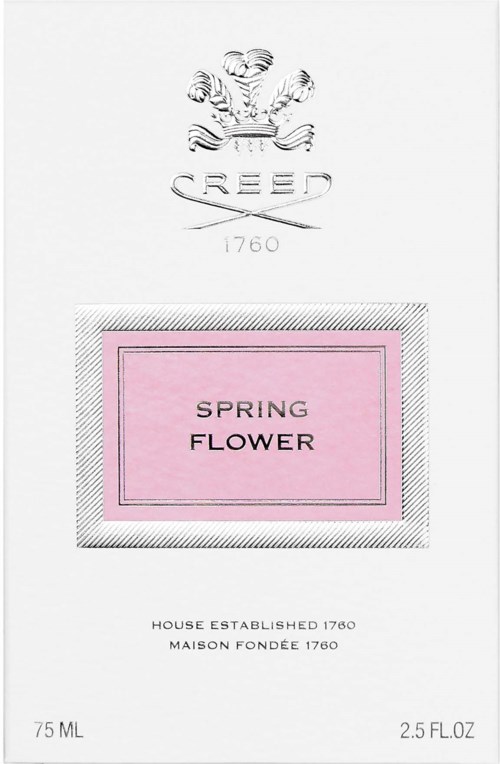 Ett parfymetikett med en rosa rektangel som säger 'Spring Flower' och en vapensköldslogg längst upp.
