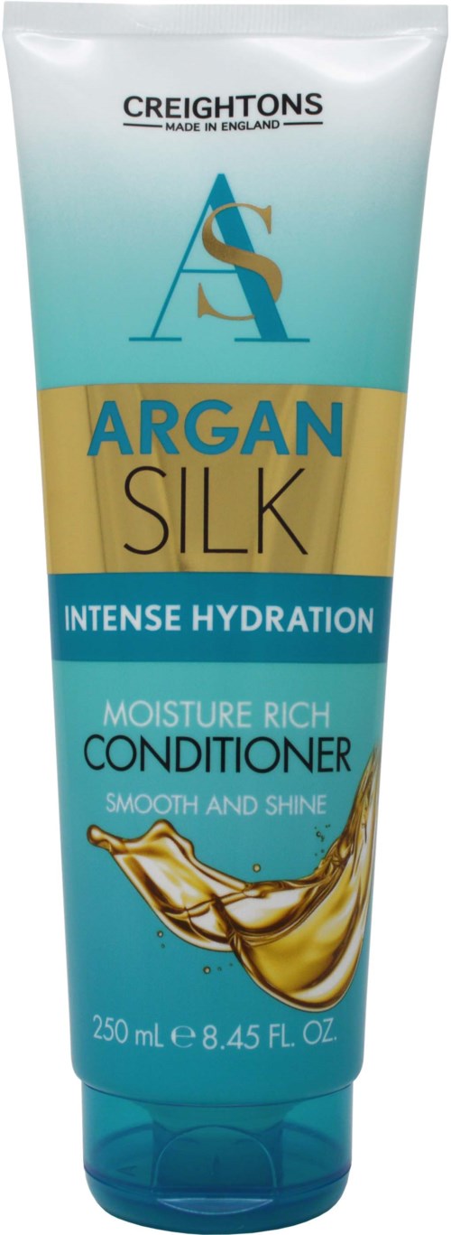 A tube of Creightons Argan Silk conditioner for intense hydration and shine. It is 250 ml with golden and blue colors.