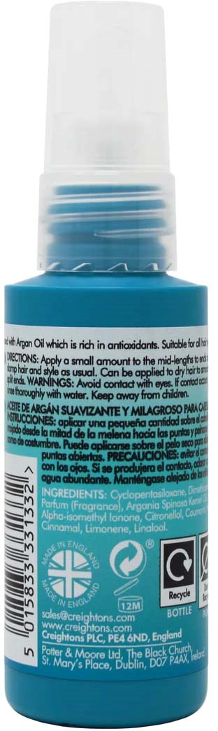 A small blue bottle with a white cap, containing skincare or cosmetic product with text and symbols on the label.