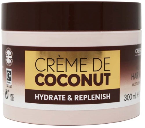 A jar of coconut hair cream called 'Crème de Coconut' for hydration and repair, containing 300 ml.