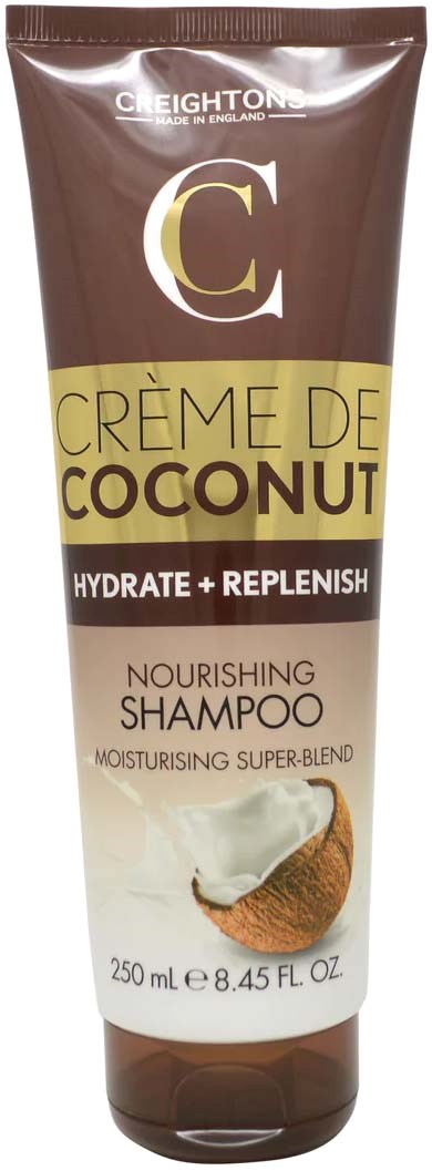 A brown tube of shampoo with a coconut image, labeled 'Crème de Coconut' for nourishing hair. It promotes hydration and replenishment.