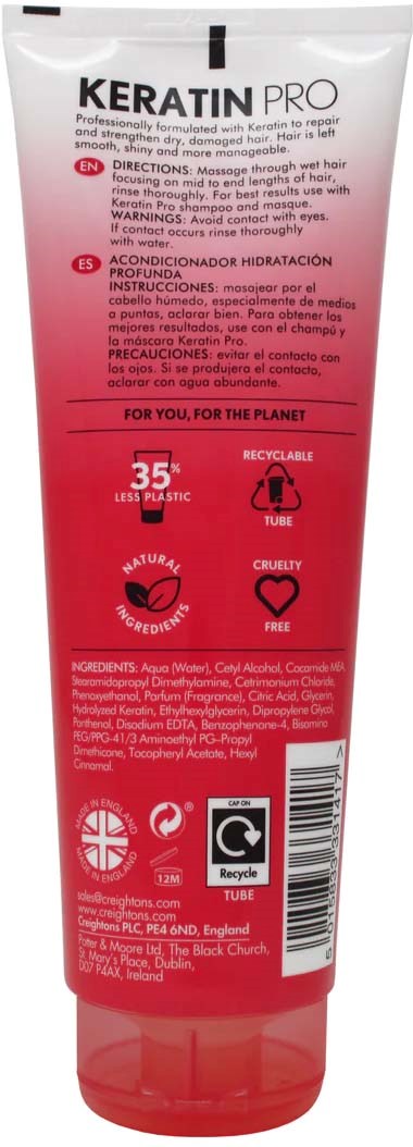 A red and white tube labeled "KERATIN PRO" with instructions, recycling icons, and a cruelty-free symbol.