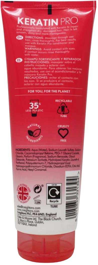 Red tube labeled 'KERATIN PRO' with icons for recycling and cruelty-free. Contains hair treatment product for strengthening and repairing.