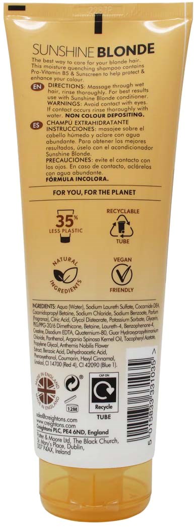 A yellow tube labeled 'Sunshine Blonde' with instructions, recycling symbols, and ingredients listed.
