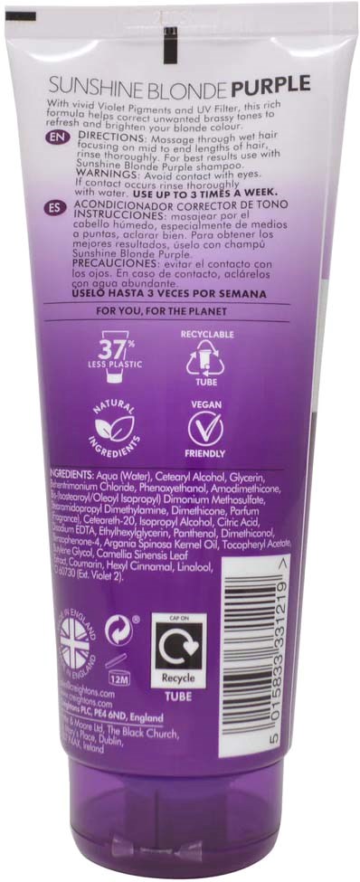 A purple and white tube of hair dye with instructions and symbols indicating vegan, recyclable, and temperature information.