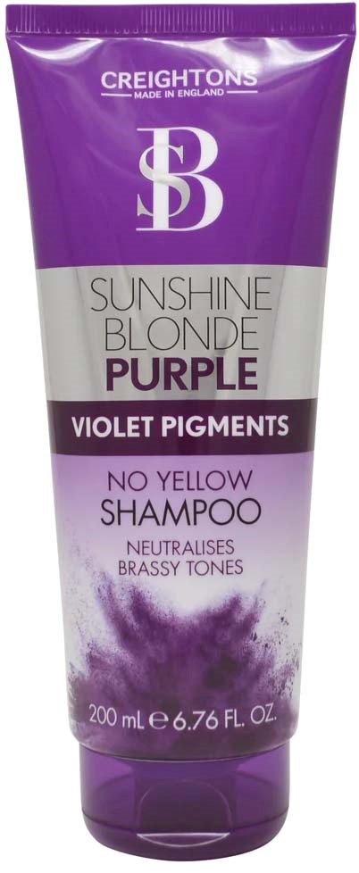 Purple shampoo bottle with text about violet pigments and no yellow tones, containing 200 ml.