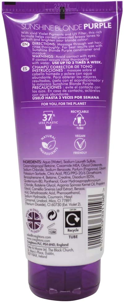 A purple tube for hair dye with instructions, ingredients, and various icons for recycling and product details.