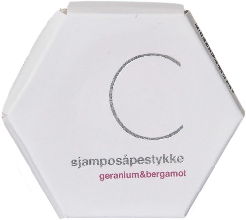Hexagon-shaped packaging with a large letter C, text in Norwegian, and a pink note about geranium and bergamot.