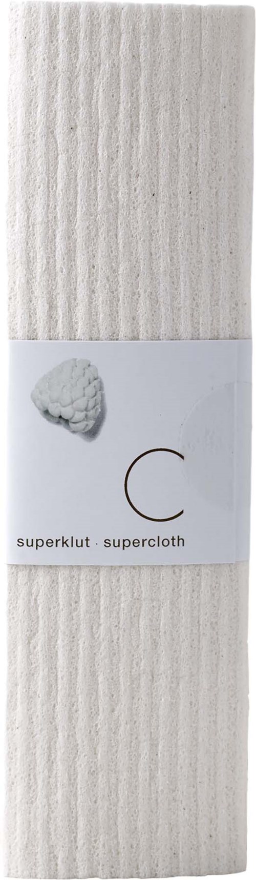 Ett paket med vit tyg med en etikett som visar en bomullstuss och en metallring.