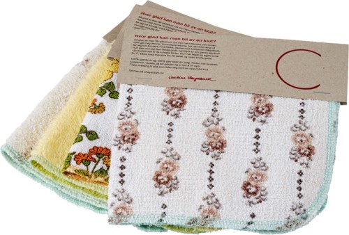 A stack of colorful kitchen towels with floral and stripe patterns, partially covered by a brown paper band.