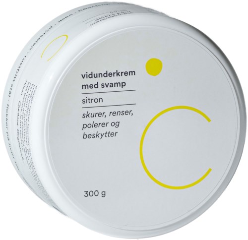 En vit behållare med gula cirklar och svart text som beskriver kräm för svampbehandling med citron doft.