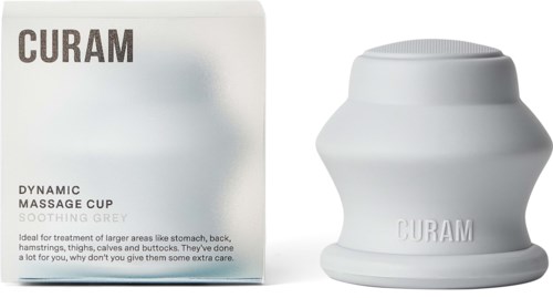 Eine weiße Massagekugel mit breiter Basis neben der Verpackung, zum Behandeln großer Flächen wie Bauch und Rücken.