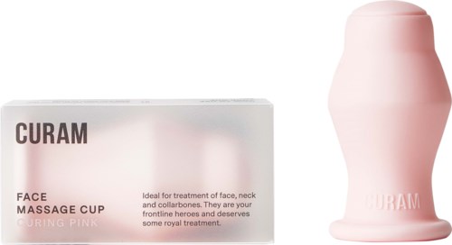 Eine Box mit der Aufschrift 'Curam Face Massage Cup Curing Pink' und eine pinke Silikon-Gesichtsmassagekelch daneben.