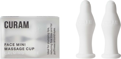 Verpackung für Mini-Massageglocken und eine kleine Box mit der Aufschrift 'CALMING' für die Anwendung um die Augen, für Gesichtsmassage.