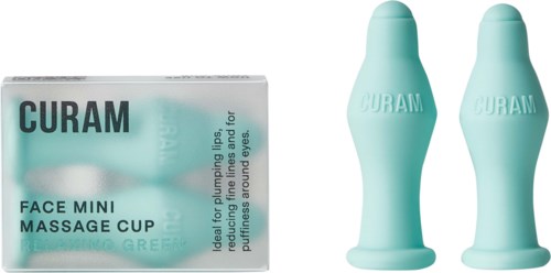 Zwei kleine blaue Massagebecher und eine Box mit der Aufschrift 'CURAM FACE MINI.'