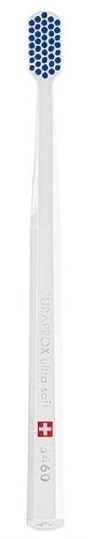 A toothbrush with a white handle and blue bristles, designed for cleaning teeth.
